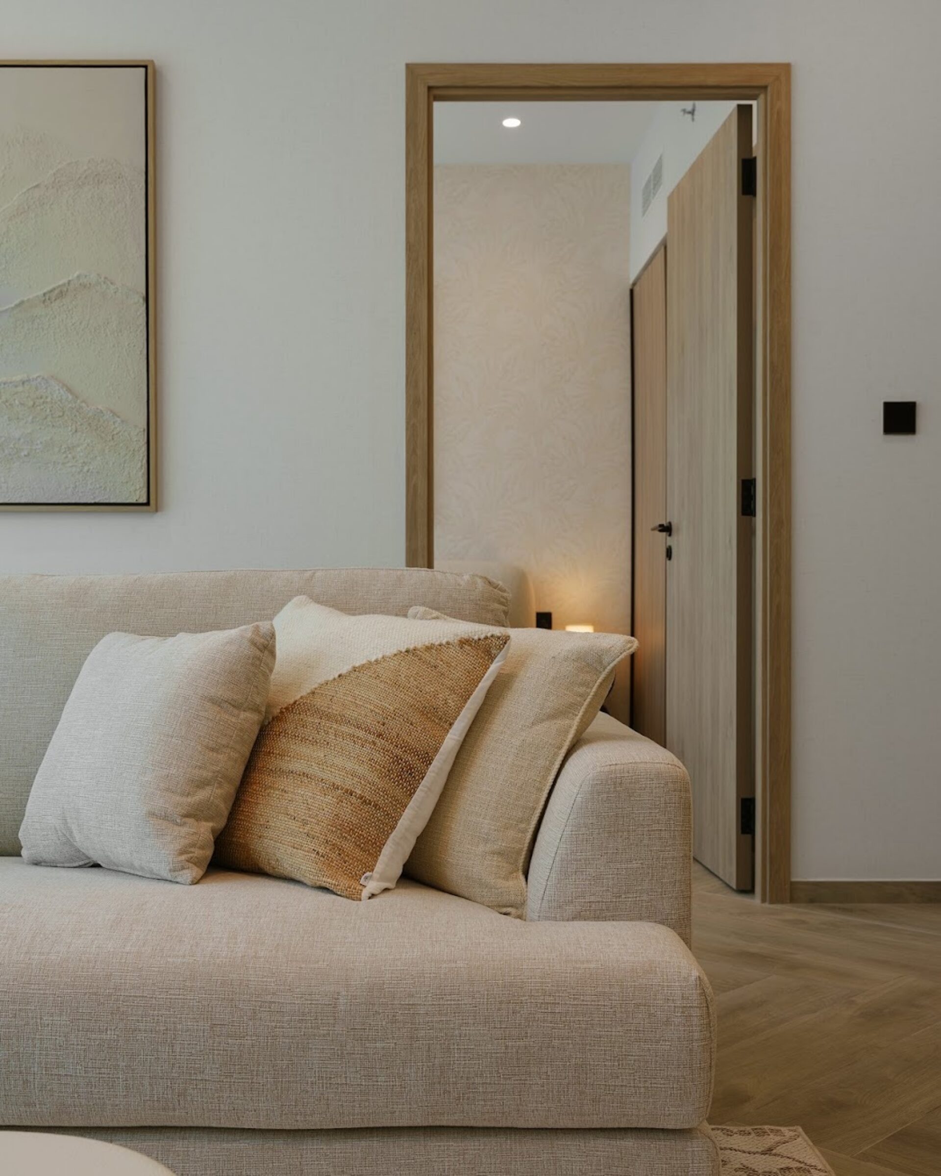 Living room in a property prepared by EAP, with a cream sofa and cushions